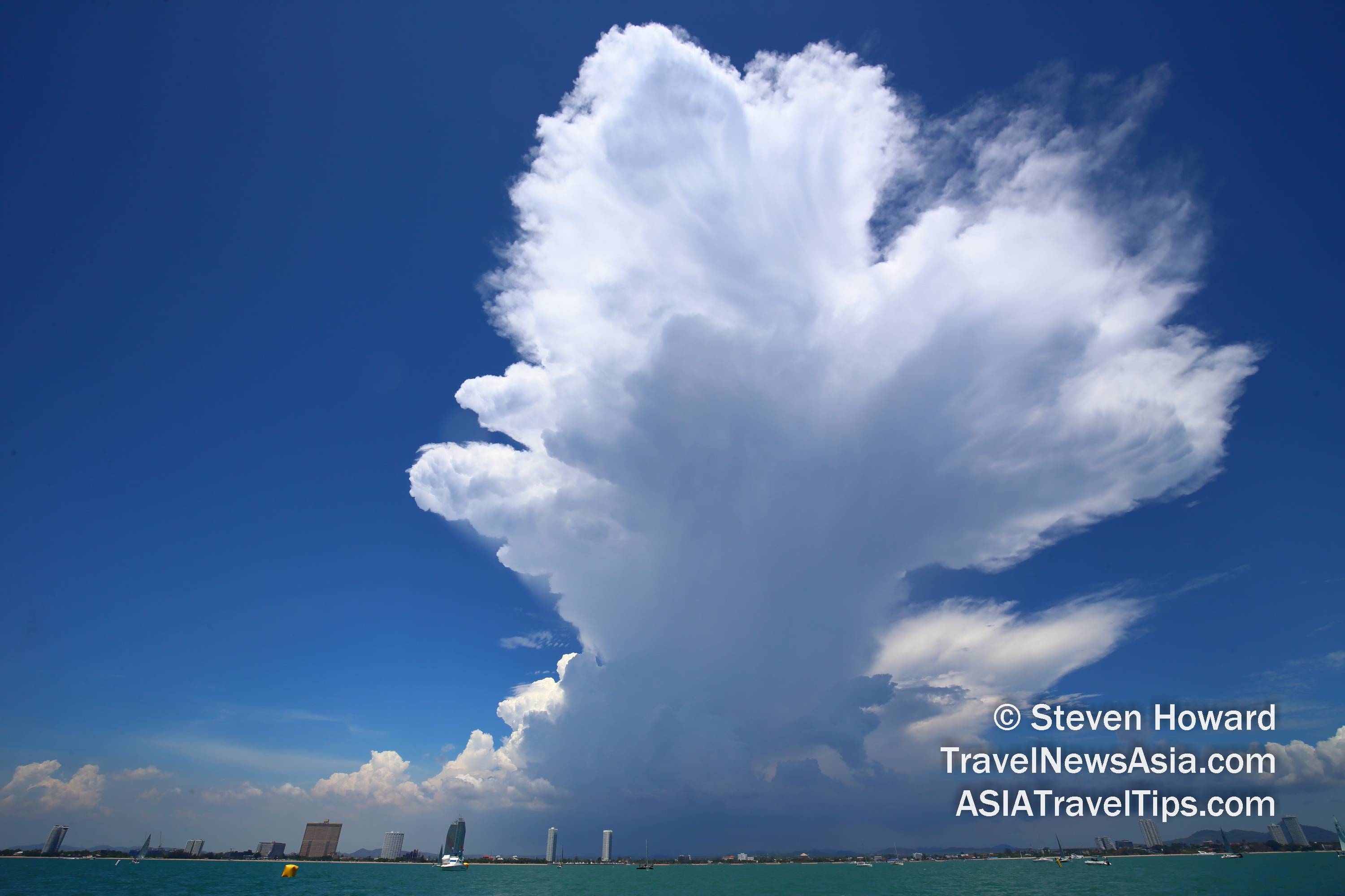 The IATA Turbulence Aware platform enables pilots and dispatchers to choose optimal flight paths, avoiding turbulence and flying at optimum levels to maximize fuel efficiency and thereby reduce CO2 emissions. Picture by Steven Howard of TravelNewsAsia.com of clouds rolling over Pattaya, Thailand. Click to enlarge.