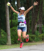 A participant at the 2013 Laguna Phuket Triathlon having fun competing. Sports tourism is growing rapidly in Thailand