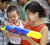 Pictures of Songkran 2012, taken on Friday, 13 April 2012, on Silom Road in Bangkok.