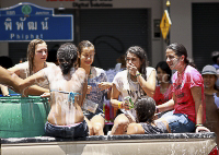 Pictures of Songkran 2012, taken on Friday, 13 April 2012, on Silom Road in Bangkok.