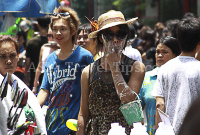 Pictures of Songkran 2012, taken on Friday, 13 April 2012, on Silom Road in Bangkok.