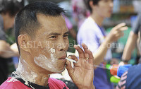 Pictures of Songkran 2012, taken on Friday, 13 April 2012, on Silom Road in Bangkok.