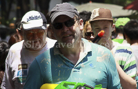 Pictures of Songkran 2012, taken on Friday, 13 April 2012, on Silom Road in Bangkok.