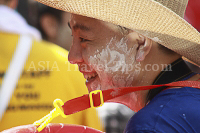 Pictures of Songkran 2012, taken on Friday, 13 April 2012, on Silom Road in Bangkok.