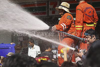 Pictures of Songkran 2012, taken on Friday, 13 April 2012, on Silom Road in Bangkok.