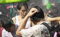 Pictures of Songkran 2012, taken on Friday, 13 April 2012, on Silom Road in Bangkok.