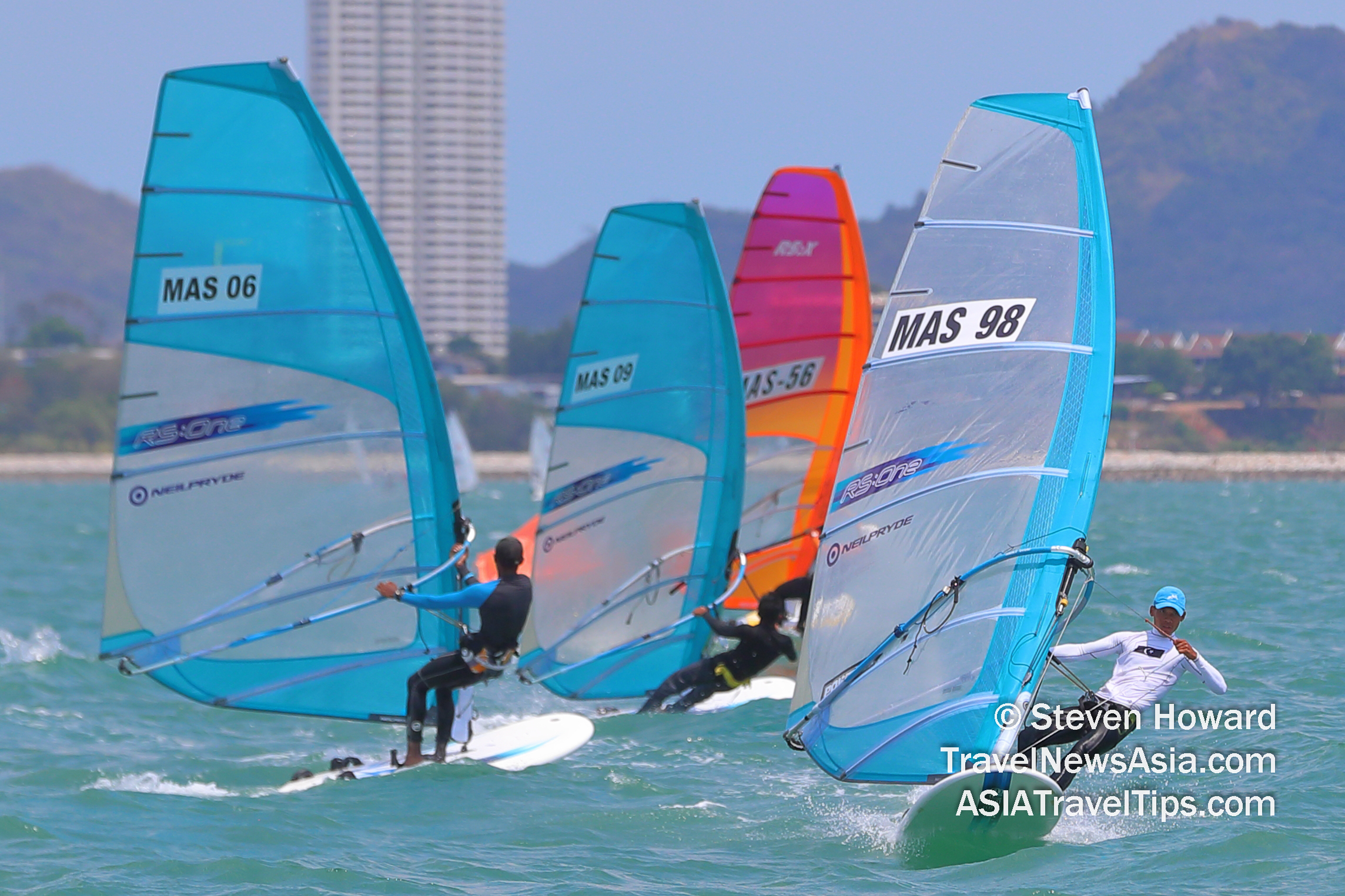 Ilham Bin Wahab (right, sail MAS98) from Malaysia won the Windsurfing RS One Class competition at Top of the Gulf Regatta 2019 in Pattaya, Thailand. Picture by Steven Howard of TravelNewsAsia.com Click to enlarge.
