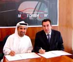 DWTC Director General Mubarak bin Fahad (left) signing the deal to bring 4x4 off-road-circuit to Dubai for the Motor Show along with Naoum Kikano, Managing Director of Alpha Omega Services