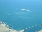 This aerial photo of The Palm, Jebel Ali taken from a plane shows the Crescent breakwater already spectacularly emerging from the sea.
