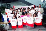 Delighted fans receive autographed Hong Kong Welcomes You! T-shirts from Jackie and HKTB Executive Director Clara Chong