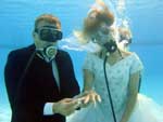Christopher Schmidt of Germany and Suzzana Cernak of Slovakia tie the knot under water