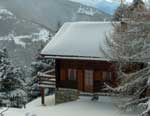 Cabin on a Snowy Mountain