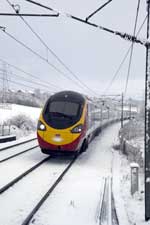 Train travelling through a snow covered English countryside - click to enlarge