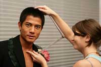 Aaron Kwok posing at Madame Tussauds in Hong Kong