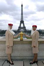 Emirates cabin crew members Lorena Serrano and Mina Ezzine with the Webb Ellis Trophy in Paris - click to enlarge