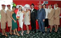 Ms Audrey Quek (fourth from left) wins "Best Dressed to the Races" award.  She is flanked by judges Catherine Ng, General Manager of Affluent magazine (third from left); Eunice Olsen, Nominated Member of Parliament (fifth from left); Christian Barker, Editor-in-Chief of The Rake magazine (fifth from right); Mr Richard Vaughan, Emirates' Senior Vice President, Commercial Operations, East Asia and Australasia (fourth from right) and Rosalie Erceg from the Victoria Racing Club (click to enlarge - opens in a new tab/window)