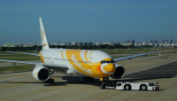 NokScoot Airlines Boeing 777-200ER HS-XBC at Don Mueang Airport in Bangkok, Thailand