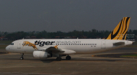 Tigerair Airbus A320 reg: 9V-TAT at SoekarnoHatta International Airport in Jakarta, Indonesia (14 November 2015).