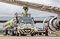 An Air BP tanker driver under the wing of an A320 aircraft at Galeao Airport in Rio De Janeiro, Brazil.