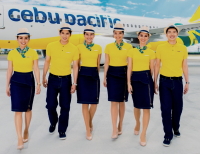 Cebu Pacific's new Cabin Crew uniforms designed by Jun Escario. Our apologies on the quality of the picture, it was not taken by ASIATravelTips.com but was supplied to us by the airline.