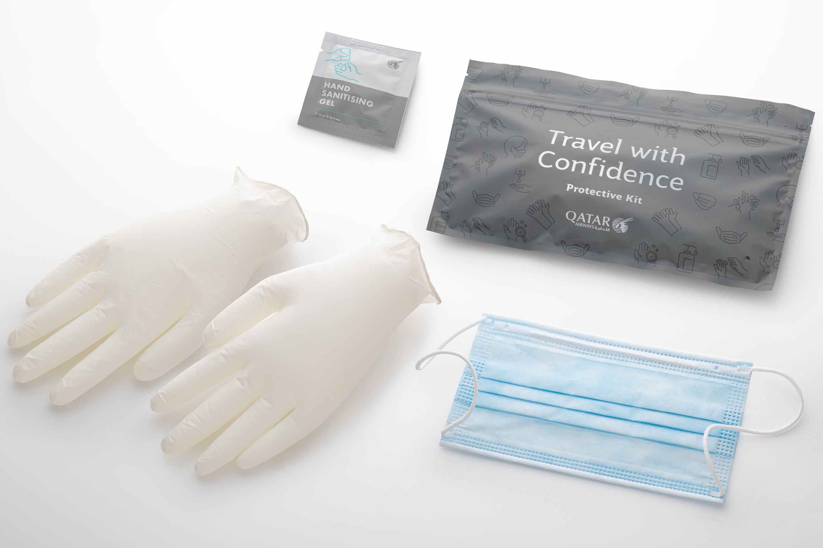 All Qatar Airways passengers are now being provided with a complimentary protective kit. The ziplock pouch contains a single-use surgical face mask, large disposable powder-free gloves and alcohol-based hand sanitiser gel. Business Class customers receive the same protective items but with a larger 75ml sanitiser gel. Click to enlarge.