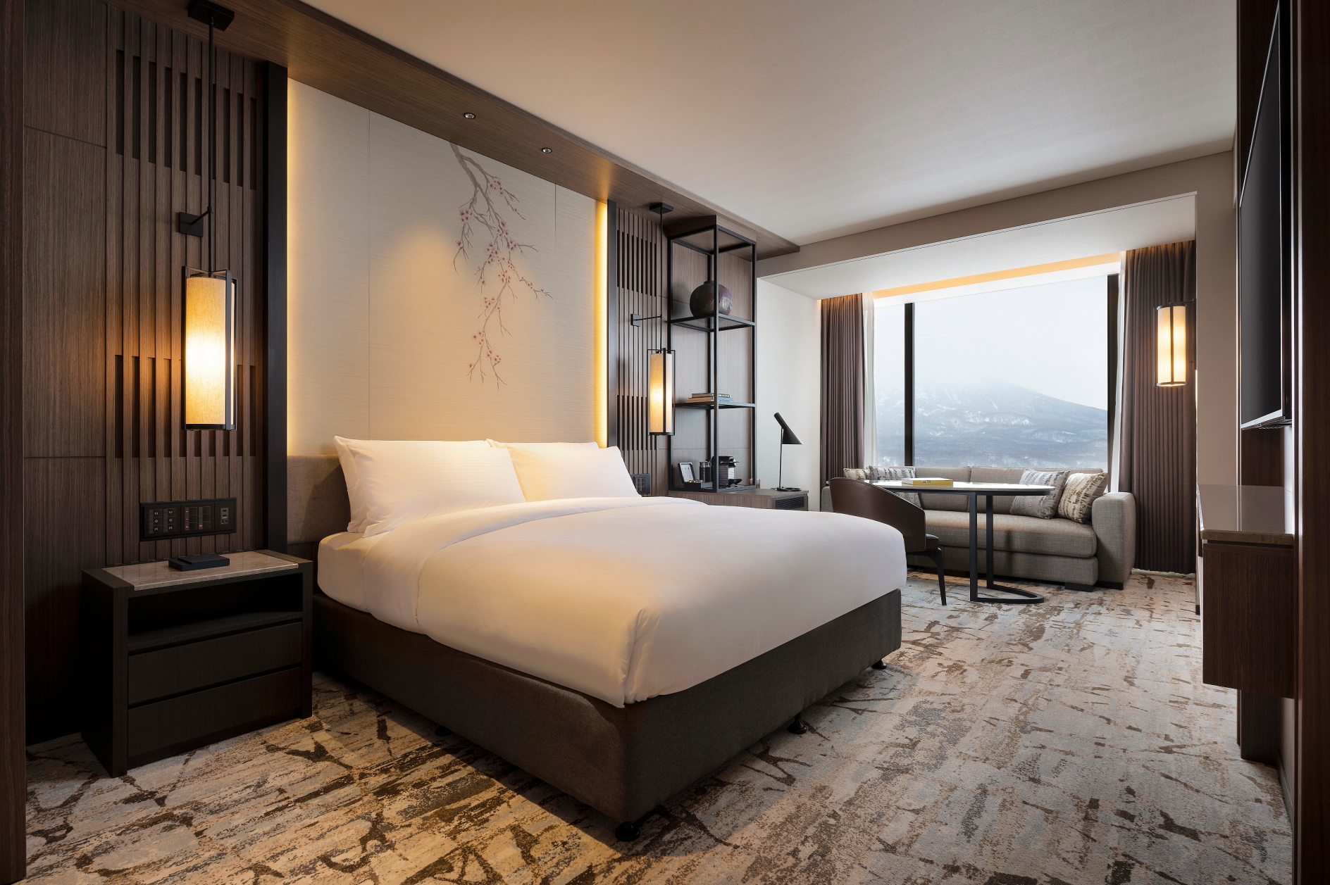 Luxurious bedroom of a Yotei Suite at Higashiyama Niseko Village, a Ritz-Carlton Reserve hotel. Click to enlarge.