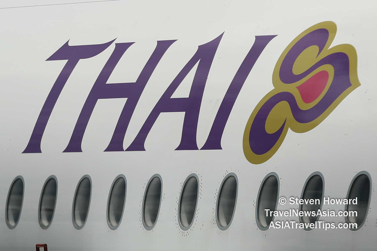 Thai Airways logo on an Airbus A350-900. Picture by Steven Howard of TravelNewsAsia.com Click to enlarge.