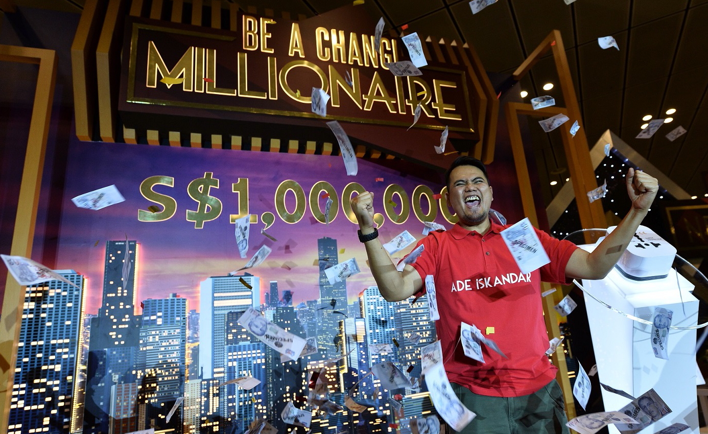 Ade Iskandar Roni celebrates winning S$ 1 Million in the 2016 Be a Changi Millionaire shopping promotion