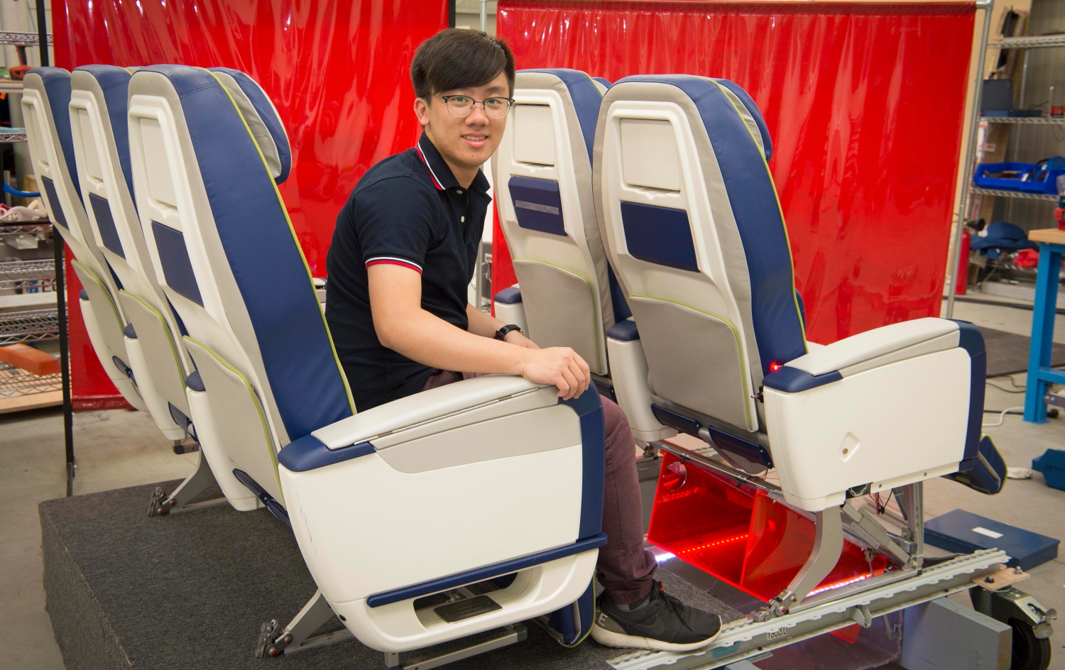 The new aircraft cabin design by Team DAELead from The University of Hong Kong fully utilizes the space between the cabin floor and the cargo ceiling to give the passengers their own personal luggage space beanth the seat in front of them.