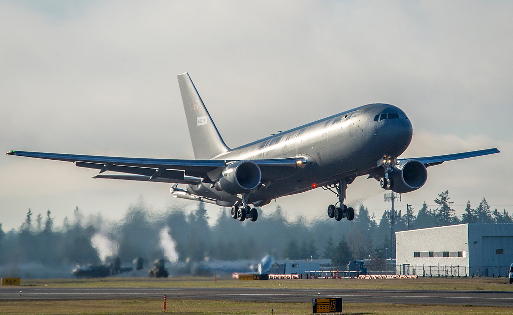 The first KC-46 tanker for the U.S. Air Force takes off from Paine Field in Everett, Wash., on its maiden flight. During the 210-minute flight, pilots took the aircraft to 39,000 feet and performed operational checks on engines, flight controls and environmental systems. The KC-46 is a multirole tanker than can refuel all allied and coalition aircraft compatible with international aerial refueling procedures and can carry passengers, cargo and patients. Photo: Marian Lockhart. Click to enlarge.