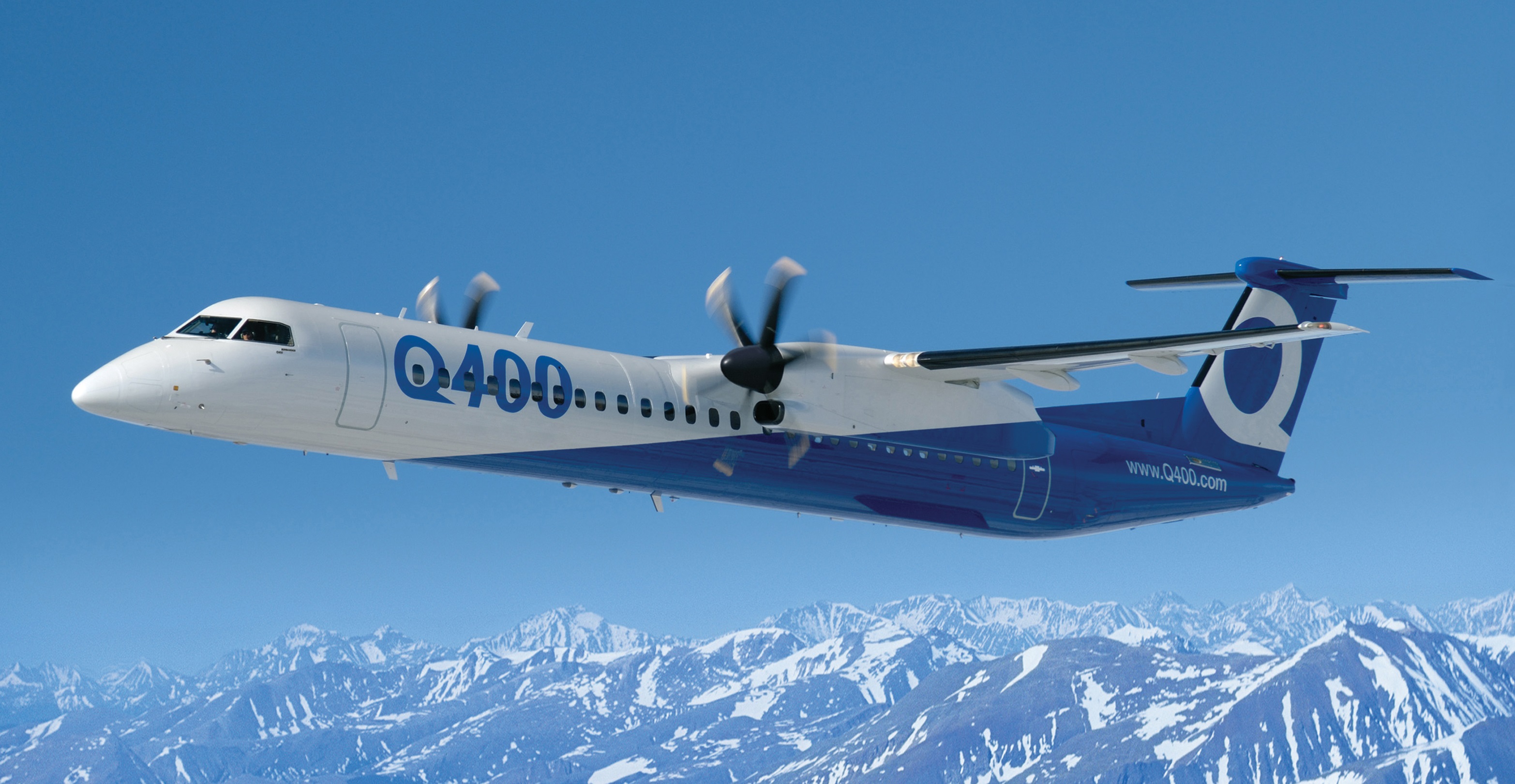 Bombardier Q400 over mountains