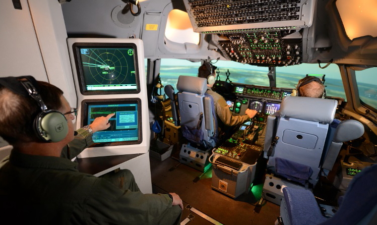 This is the Weapons Systems Trainer, which trains aircrews in a flight deck that is identical to the real aircraft, providing simulated motion of the aircraft in-flight, as well as an on-board instructor. (Boeing photo).