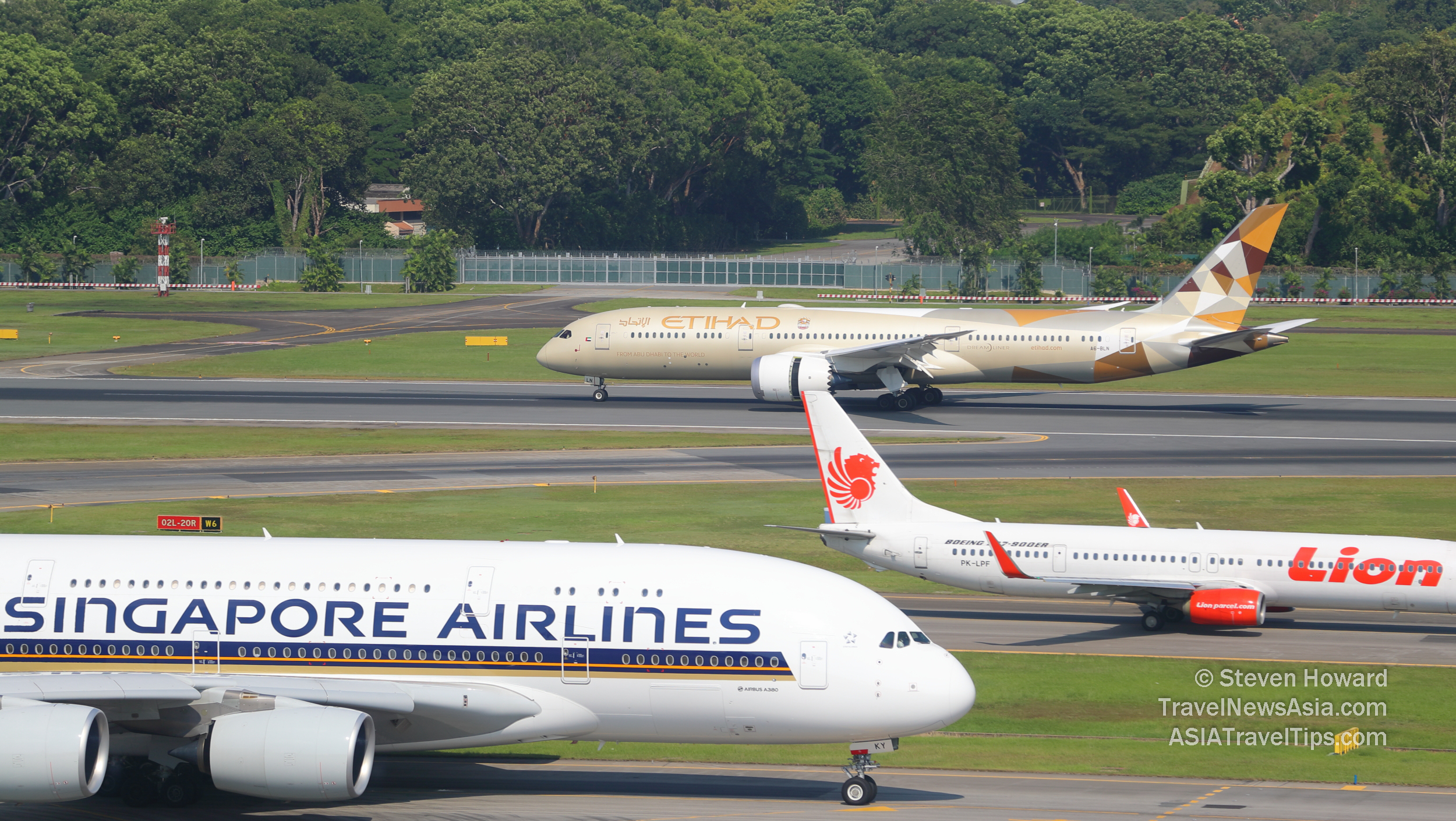 Singapore Airlines Airbus A380, Lion Air Boeing 737-900 and Etihad Airways Boeing 787-9 Dreamliner at Changi Airport in Singapore. Picture by Steven Howard of TravelNewsAsia.com Click to enlarge.