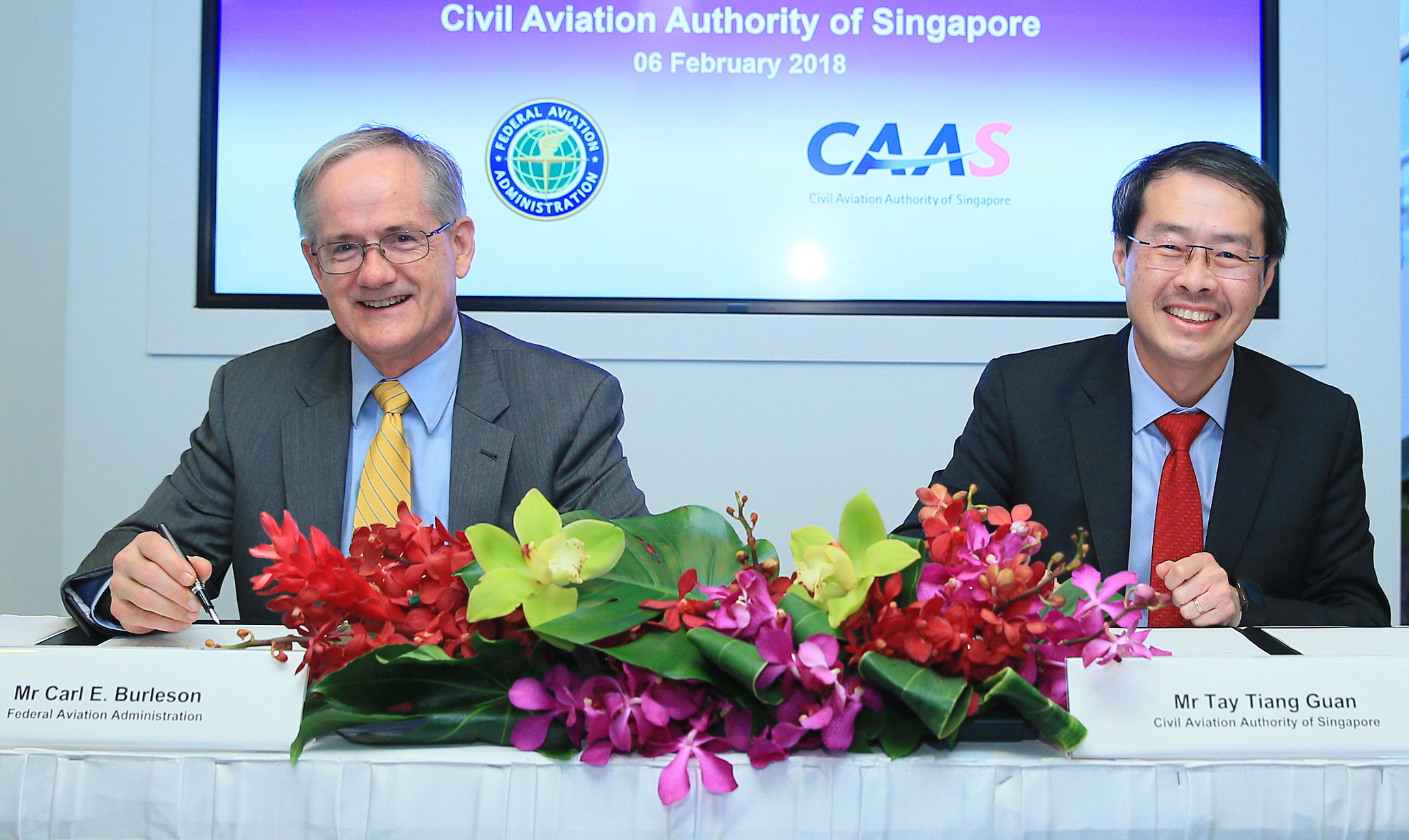 (From left to right) Mr Carl Burleson, Acting Deputy Administrator, Federal Aviation Administration (FAA), and Mr Tay Tiang Guan, Deputy Director-General, Civil Aviation Authority of Singapore (CAAS), sign revisions to the Bilateral Aviation Safety Agreement – Implementation Procedures for Airworthiness (BASA-IPA) on the sidelines of the Singapore Airshow. Click to enlarge.