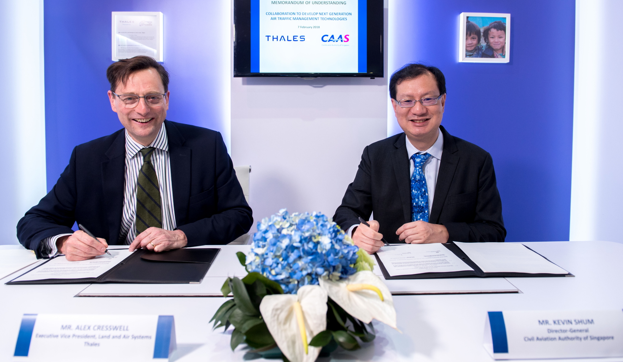 (From left to right) Mr Alex Cresswell, Thales Executive Vice President for Land and Air Systems, and Mr Kevin Shum, Director-General, Civil Aviation Authority of Singapore, sign a Memorandum of Understanding to cooperate on developing new concepts of operations for air traffic management (ATM), as well as the next generation of ATM technologies. Click to enlarge.