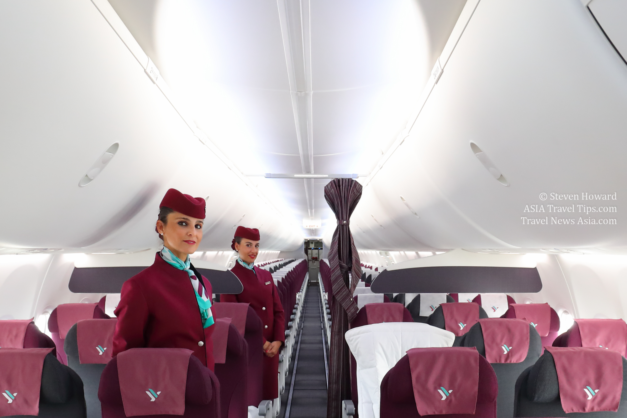 Two beautiful Air Italy stewardesses pose onboard one of the airline's Boeing 737 MAX 8 aircraft. Picture by Steven Howard of TravelNewsAsia.com Click to enlarge.