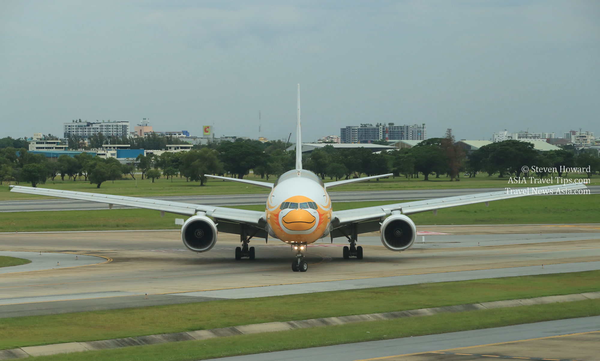 Nok Scoot Boeing 777-200 aircraft reg: HS-XBD at Don Mueang Airport in Bangkok, Thailand on 25 June 2018. Click to enlarge.