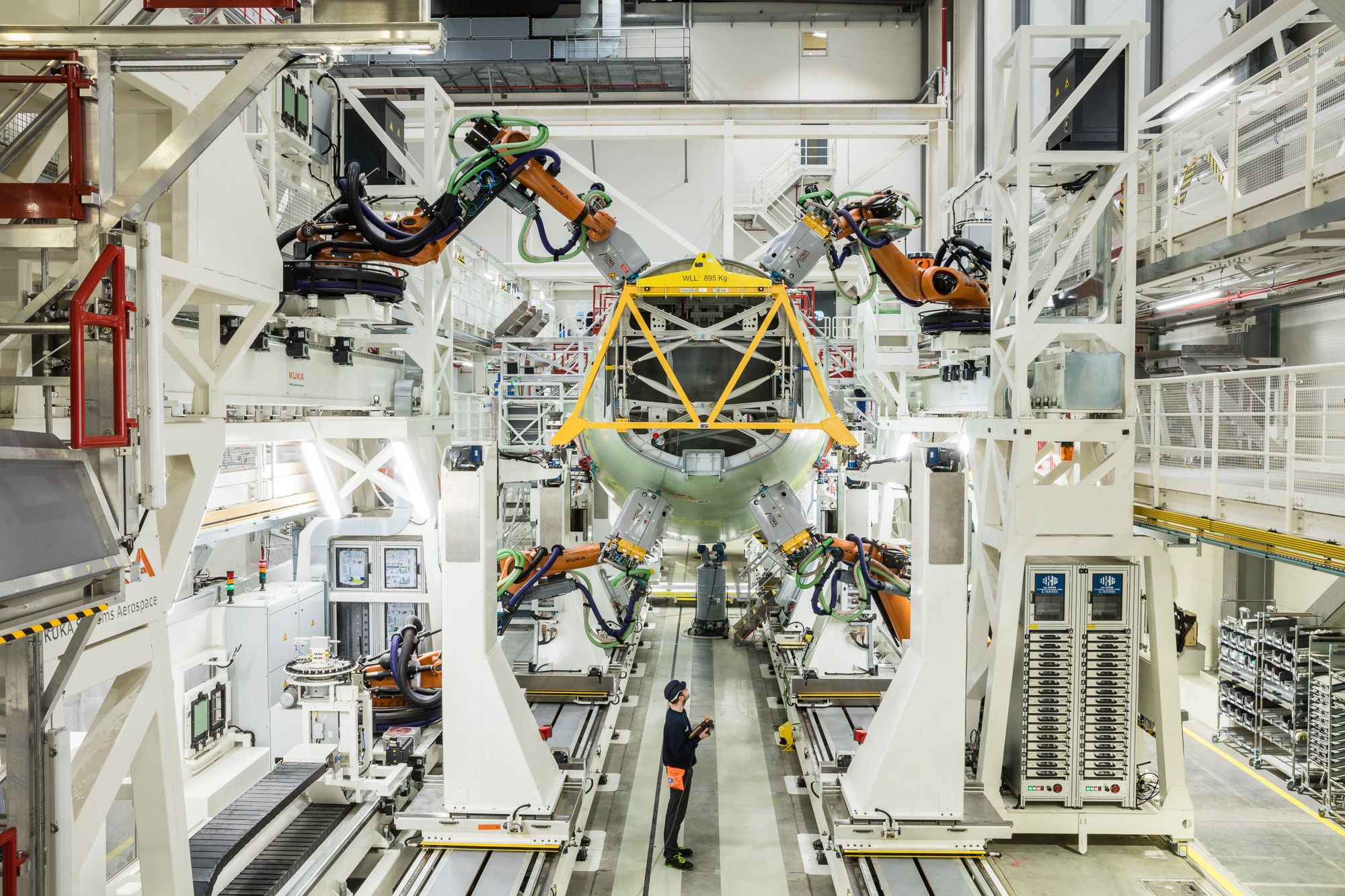 Airbus has opened an automated fuselage structure assembly line for A320 Family aircraft in Hamburg, Germany. With a special focus on manufacturing longer sections for the A321LR, the new facility features 20 robots, a new logistics concept, automated positioning by laser measurement as well as a digital data acquisition system. Click to enlarge.