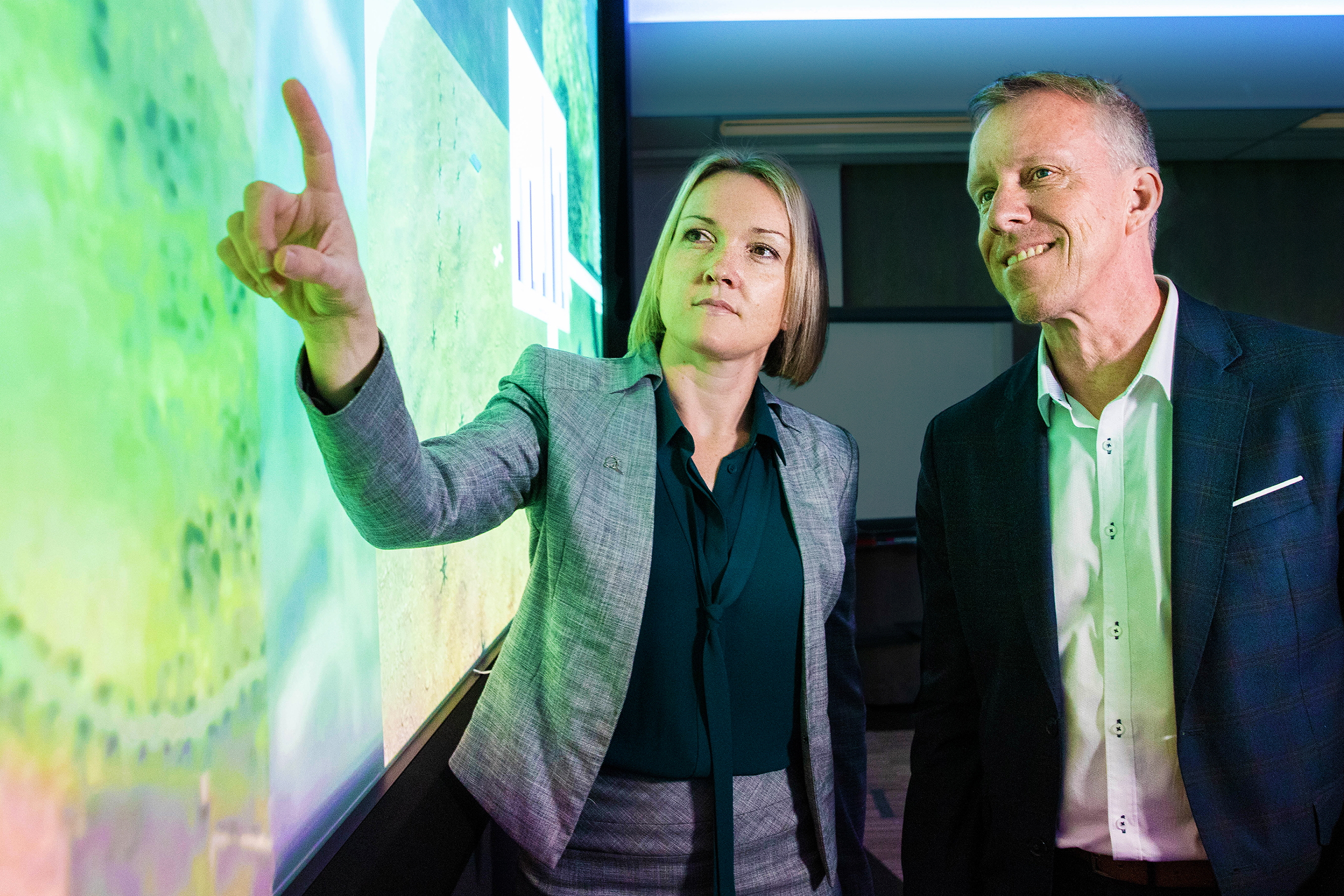 Emily Hughes, Chief Engineer for Boeing Phantom Works International discussing the AI project with Professor Jason Scholz, Trusted Autonomous Systems Defence Cooperative Research Centre. Picture: Boeing. Click to enlarge.