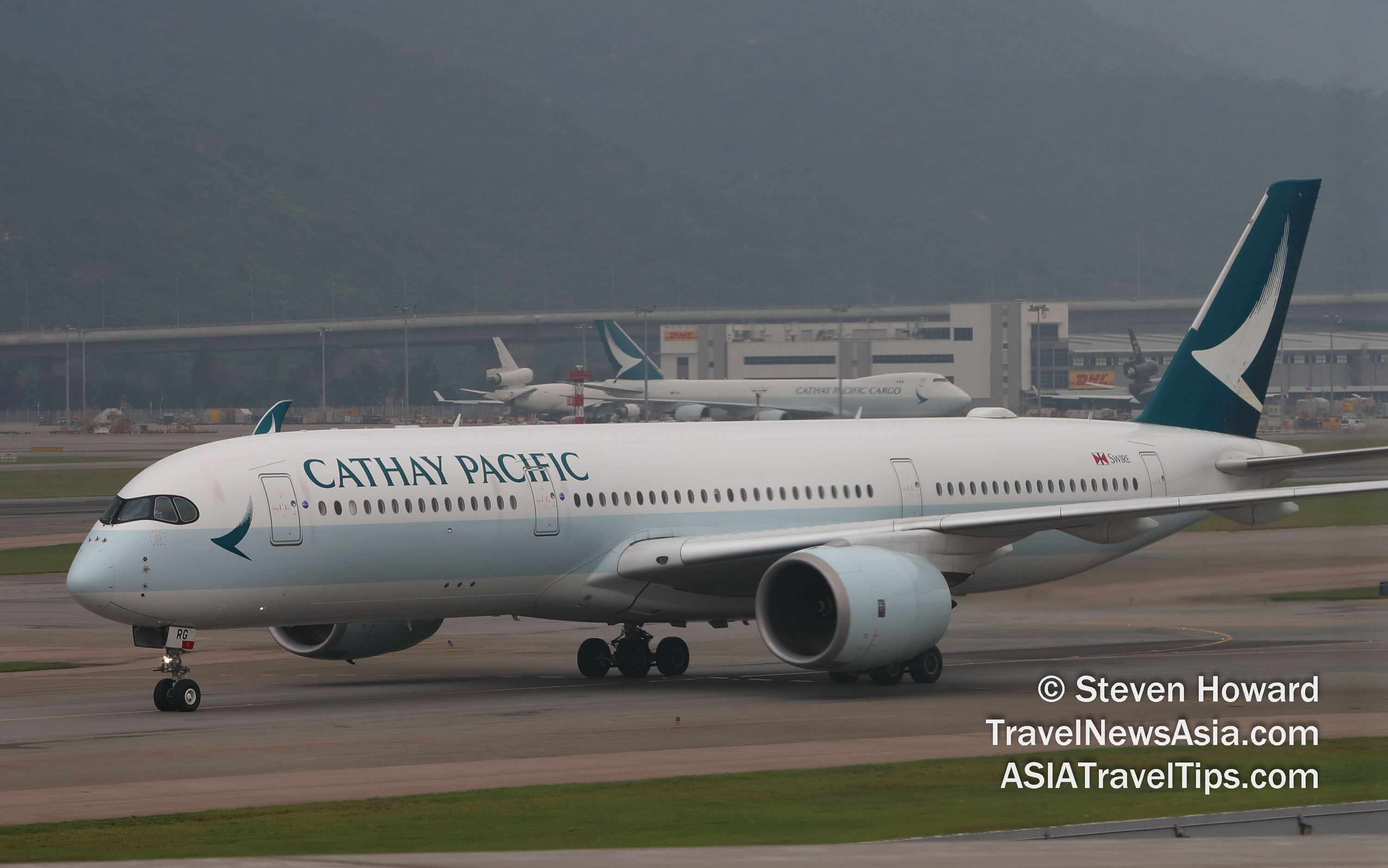 Cathay Pacific Airbus A350 and B747F at HKIA. Picture by Steven Howard of TravelNewsAsia.com Click to enlarge.