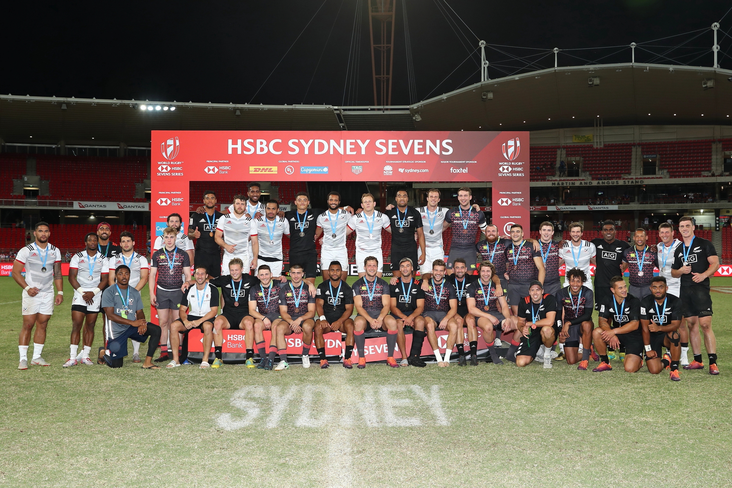 Gold, silver, bronze medalists New Zealand, USA, and England pose for a group photo on day two of the HSBC World Rugby Sevens Series in Sydney on 3 February, 2019. Photo credit: Mike Lee - KLC fotos for World Rugby. Click to enlarge.