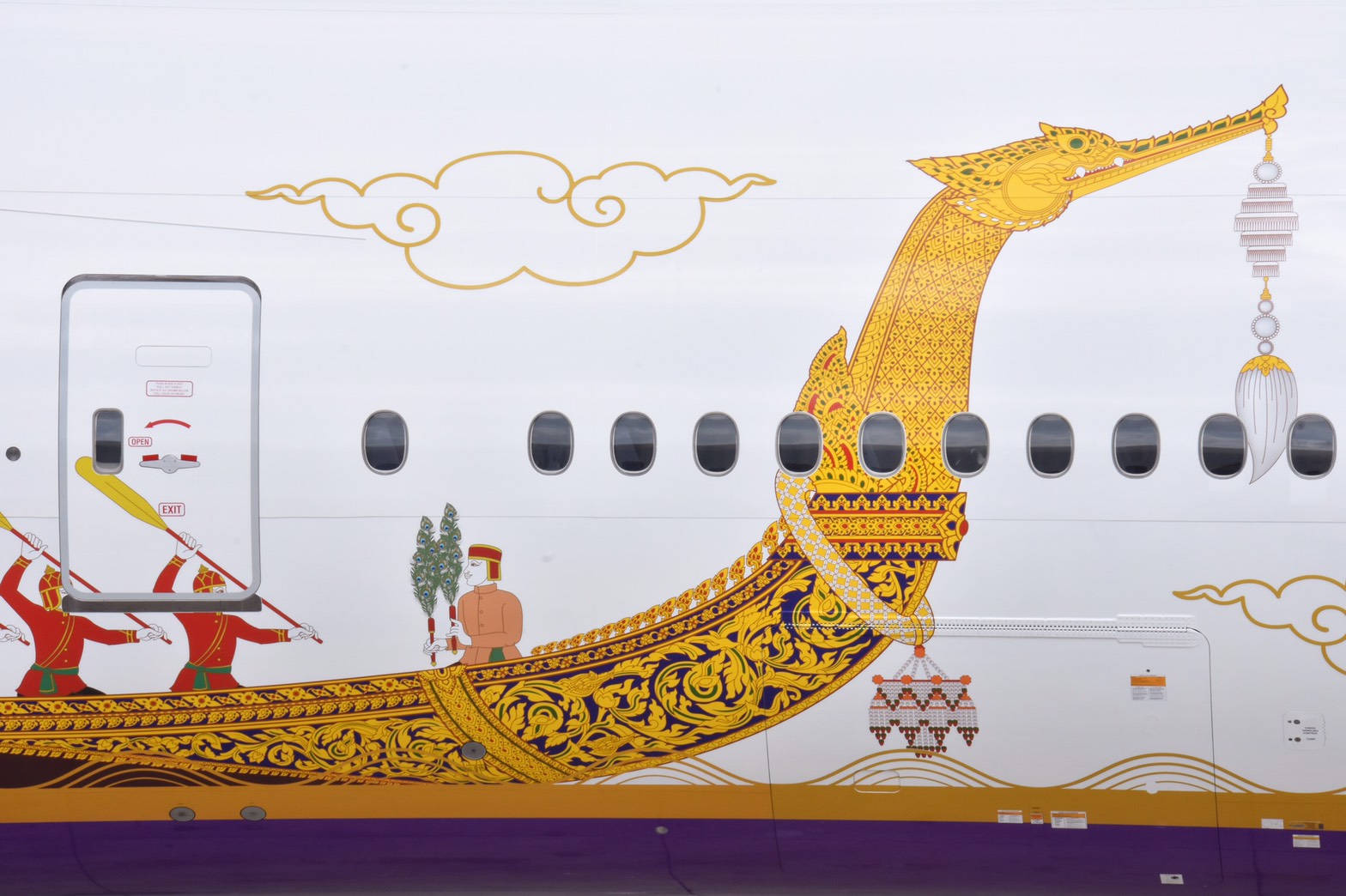 Thai Airways International has painted a Boeing 777-300, named Lahan Sai, with a special Suphannahong Royal Barge aircraft livery that commemorates the Royal Coronation Ceremony 2019-2020. Click to enlarge.